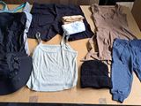 a lot of clothes that are sitting on a table
