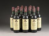 six bottles of wine are lined up in a row on a table