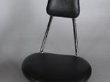 a black chair that has a black seat and a black seat