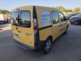 a yellow van that is parked in a parking lot
