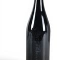 a bottle of wine that is sitting on a table