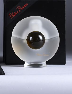 an image of a glass object with a black ball in it