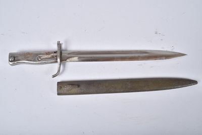 two knives that are laying on a white surface