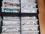 many pairs of glasses in a case on the table