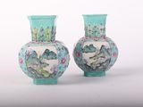 two vases sitting side by side on a white surface