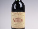 a bottle of wine that is sitting on a table
