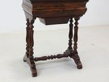 an old wooden table with a drawer on top of it