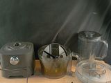 a blender and a blender sitting on a wooden table