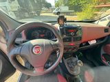 a dashboard of a car with a steering wheel and dashboard controls
