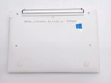 the back of a white laptop with a blue sticker on it