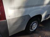 a white van that is parked in a parking lot