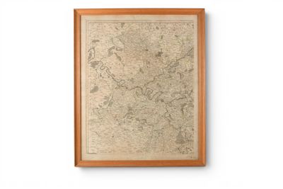 map of the world in a wooden frame on a white wall