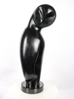 sculpture of a black bird on a marble base