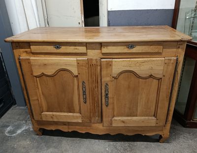a wooden cabinet with a mirror on top of it