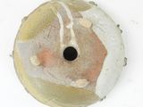 a close up of a vase with a hole in it