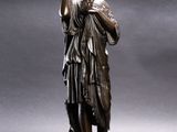 bronze statue of a woman holding a baby in her arms