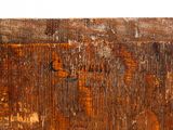 a close up of a piece of wood with rust on it