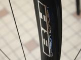 a close up of a bike tire on a sidewalk