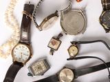 many different types of watches on a white surface