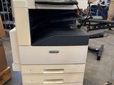 a white and black printer sitting on top of a table