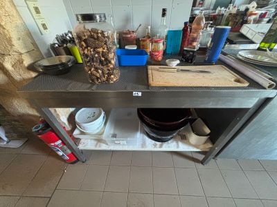 a kitchen counter with a bunch of cooking utensils on it