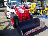 a tractor and a bulldozer parked in a lot