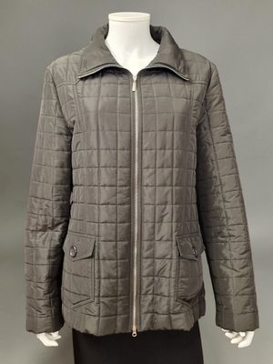 a woman ' s jacket with a zippered collar and a zippered collar