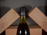 a bottle of wine that is sitting on a table
