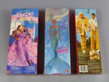three barbie dolls are lined up in a row on a table