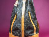 a louis vuitton backpack bag on a pink background