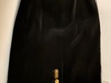 a black skirt with a zipper on the side of it