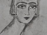 drawing of a woman ' s face in black and white on a wall