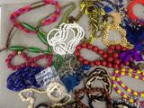 many different types of beaded necklaces and bracelets on the table