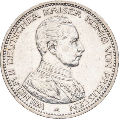 une vieille pièce d'argent sur laquelle figure le portrait d'un homme