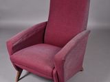 an image of a pink chair with wooden legs on a grey background