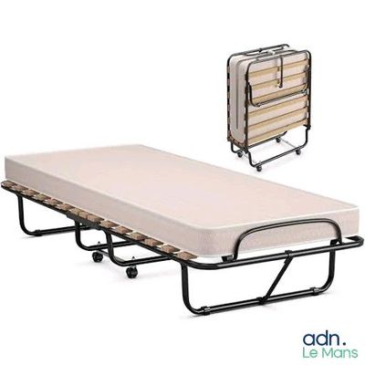 a folding bed with a mattress and a folding table