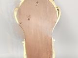 an image of a pair of gold shoes with a white background