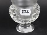 a glass vase with a number on it on a table