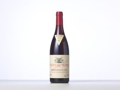 a bottle of red wine sitting on top of a table