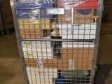 a metal cart with many boxes on it in a warehouse