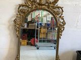 a mirror that is sitting on the floor in a room