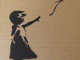 un tableau représentant une petite fille tenant un ballon rouge