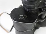 a close up of a black camera with a strap