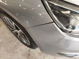 a close up of a car ' s headlight and front bumper