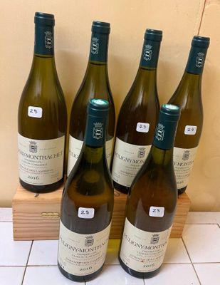 six bottles of wine sitting on top of a counter next to a wooden box
