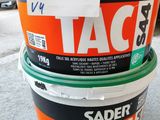 three buckets of paint sitting on the floor next to each other