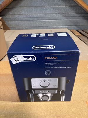 a box of a coffee maker sitting on top of a table