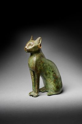 an egyptian bronze figure of a cat
