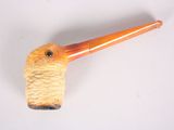 a pipe that is sitting on a white surface