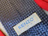a close up of a necktie with a kenzo label on it